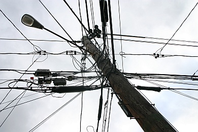 [photo of a pole with lots of wires] (c) D.Nagaj